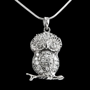 This sweet little owl is sitting on a branch and nicely decorated with cubic zirconium.